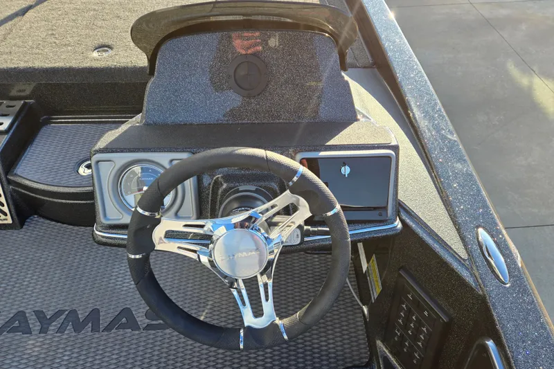 Slide: The Image of Steering wheel and dashboard of 2026 Caymas CX 20 PRO boat, featuring modern controls. - 5