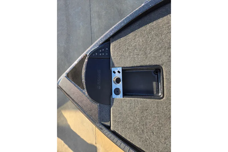 Slide: The Image of 2026 Caymas CX 20 PRO boat deck with control panel and storage compartment. - 7