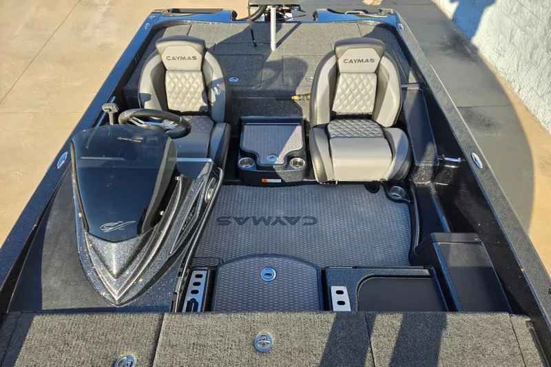 Slide: The Image of 2026 Caymas CX 20 PRO boat interior with dual seats and sleek dashboard design. - 8
