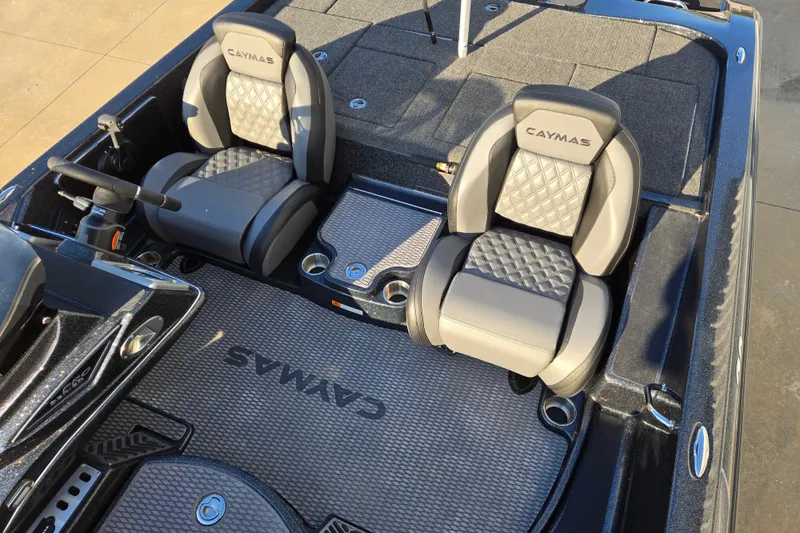 Slide: The Image of 2026 Caymas CX 20 PRO boat interior with dual seats and steering wheel. - 9