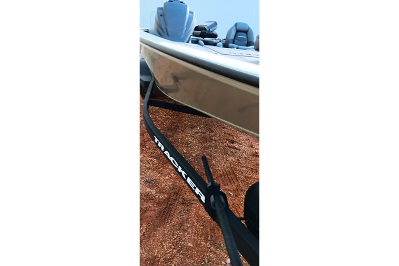 Slide: The Image of 2026 Tracker Savage 215 boat on trailer, parked on gravel surface. - 10