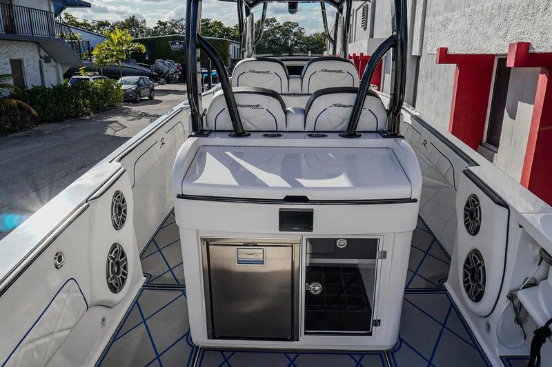 Slide: The Image of 2024 Renegade 38 Open boat interior with seating and audio system. - 18