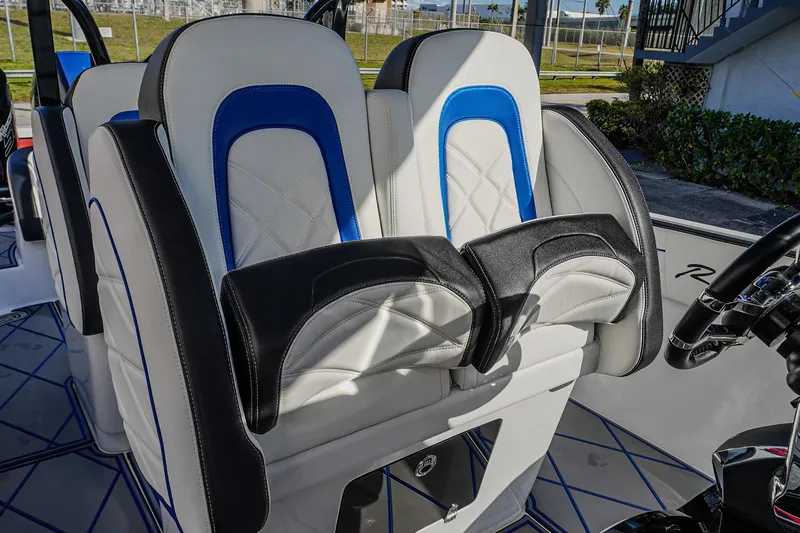 Slide: The Image of 2024 Renegade 38 Open boat seats with blue and black accents, showcasing luxury design. - 31