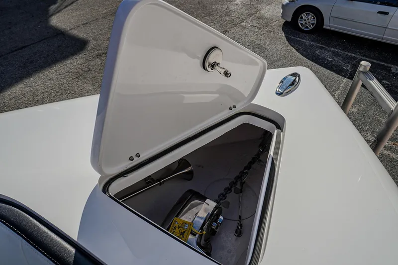 Slide: The Image of Open storage compartment on 2024 Renegade 38 Open boat, showing anchor chain and equipment. - 32