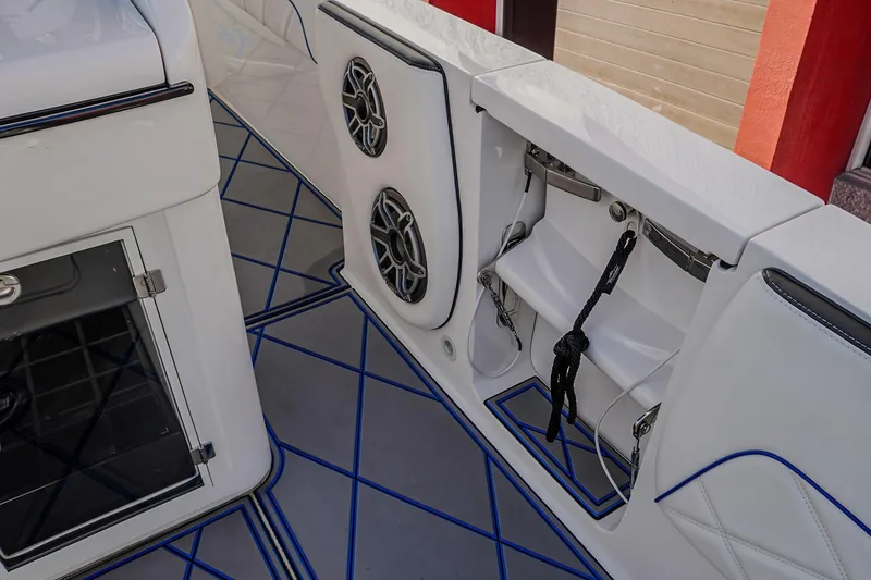 Slide: The Image of 2024 Renegade 38 Open boat interior with speakers and storage compartments. - 33