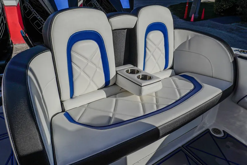 Slide: The Image of 2024 Renegade 38 Open boat seating with blue and white upholstery and cup holders. - 34