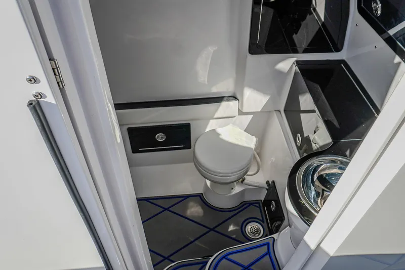 Slide: The Image of 2024 Renegade 38 Open boat interior bathroom with modern fixtures and sleek design. - 36