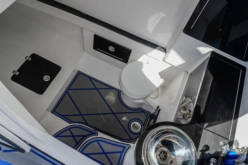 Slide: The Image of 2024 Renegade 38 Open boat interior with toilet and sink. - 37