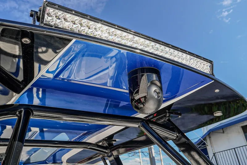 Slide: The Image of 2024 Renegade 38 Open boat with sleek blue canopy and mounted LED light bar. - 9