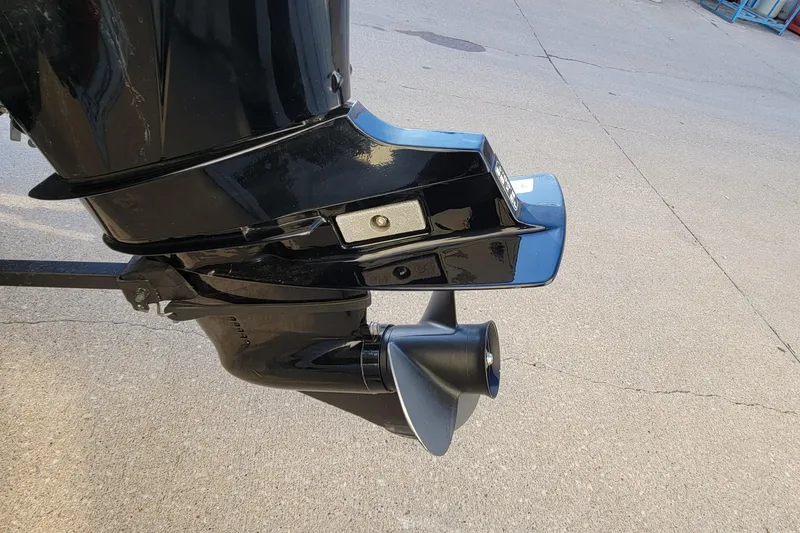 Slide: The Image of 2018 Bass Tracker Pro 16 outboard motor on concrete surface. - 11