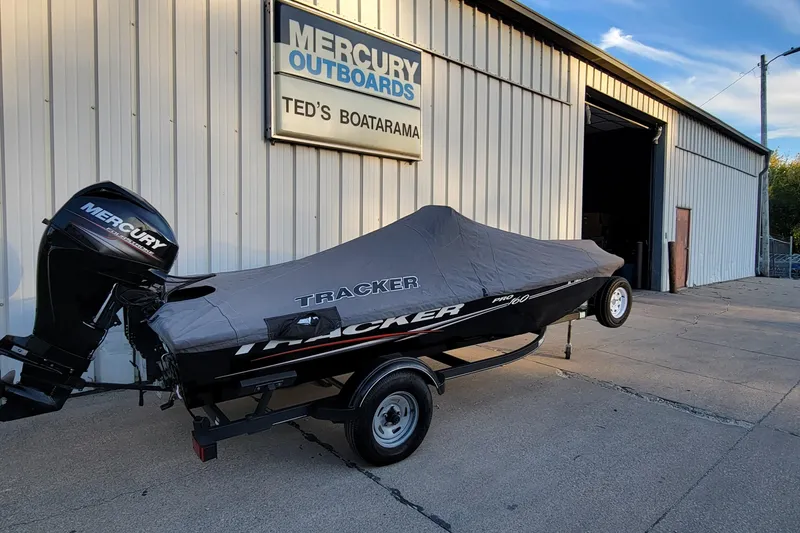 Slide: The Image of 2018 Bass Tracker Pro 16 boat with cover at Ted's Boatarama, featuring Mercury outboard. - 5