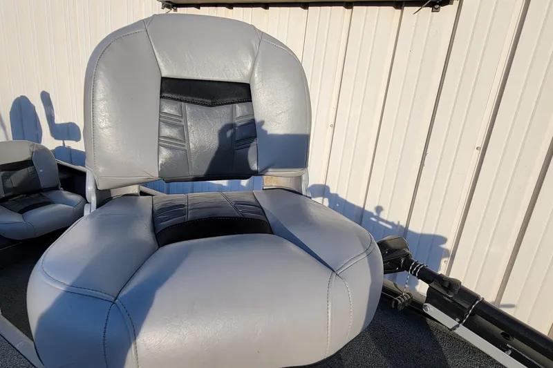 Slide: The Image of 2018 Bass Tracker Pro 16 boat seat, gray and black, against a light background. - 17