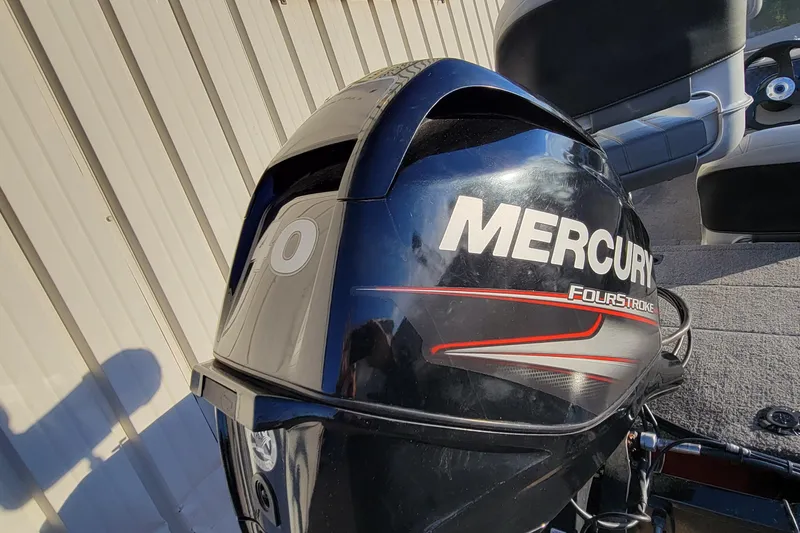 Slide: The Image of 2018 Bass Tracker Pro 16 with Mercury FourStroke engine, parked outdoors. - 19