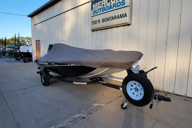Slide: The Image of 2018 Bass Tracker Pro 16 boat covered, parked at Ted's Boatarama. - 4
