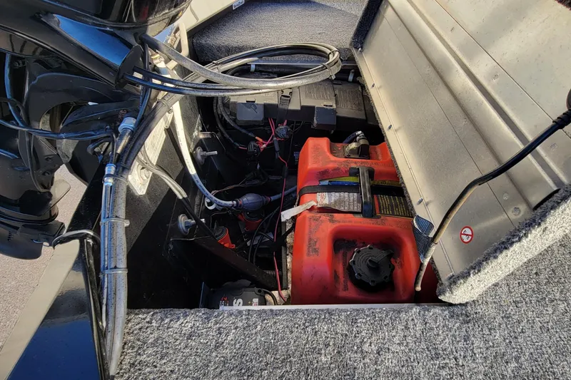 Slide: The Image of 2018 Bass Tracker Pro 16 boat engine compartment with fuel tank and wiring. - 9