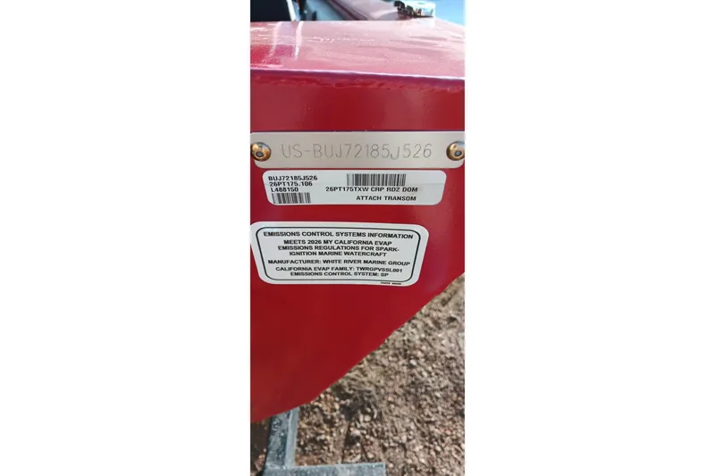 Slide: The Image of 2026 Tracker Pro Team 175 emissions control label on red surface. - 17