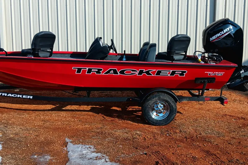 Slide: The Image of 2026 Tracker Pro Team 175 boat in vibrant red, parked on a trailer. - 2