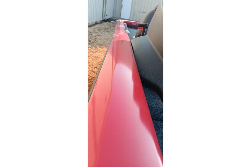 Slide: The Image of 2026 Tracker Pro Team 175 boat, red exterior detail, close-up view. - 8