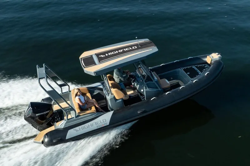 The Image of Manufacturer Provided Image: 2025 Highfield Escape 650 boat cruising on water, featuring sleek design and Mercury engine. - 0