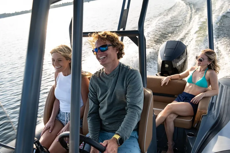 Slide: The Image of People enjoying a ride on a 2026 Highfield Escape 650 boat. - 7