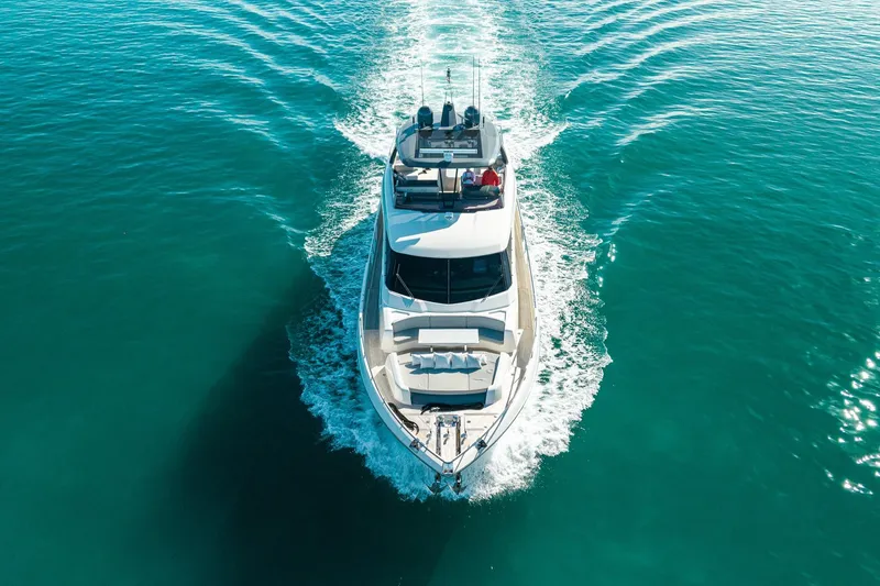 Slide: The Image of 2018 Ferretti Yachts 850 cruising on clear turquoise waters, aerial view. - 14