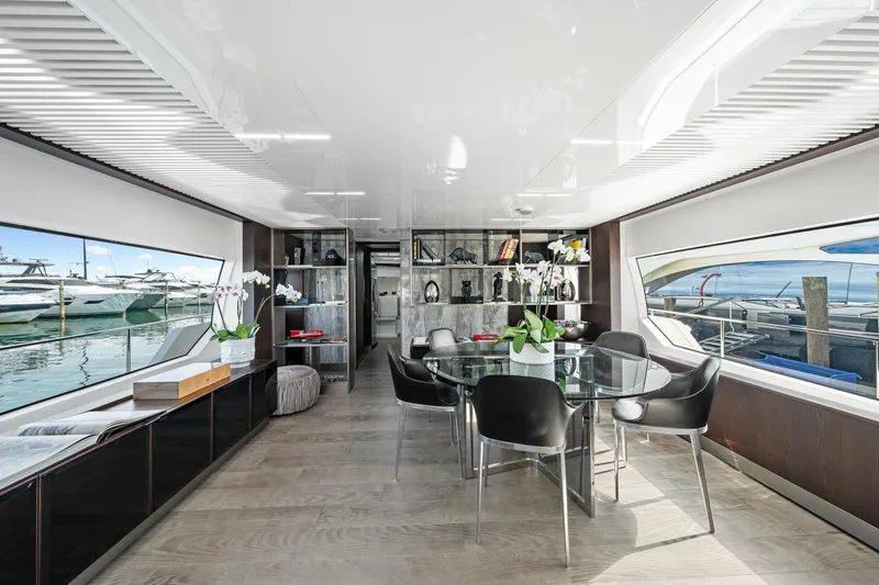 Slide: The Image of Luxurious interior of 2018 Ferretti Yachts 850 with elegant dining area and panoramic windows. - 19