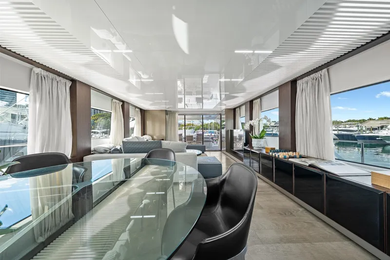 Slide: The Image of Luxurious interior of 2018 Ferretti Yachts 850 with elegant dining area and marina view. - 23
