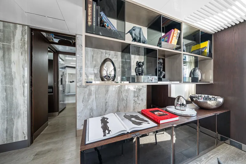 Slide: The Image of Luxurious interior of 2018 Ferretti Yachts 850 with elegant shelving and decor. - 25