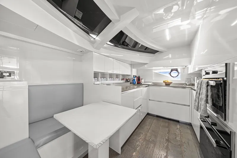 Slide: The Image of Luxurious 2018 Ferretti Yachts 850 kitchen with modern white interior and sleek design. - 34