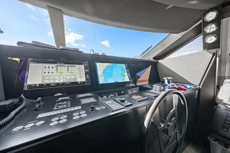 Slide: The Image of Cockpit of 2018 Ferretti Yachts 850 with navigation screens and controls. - 40