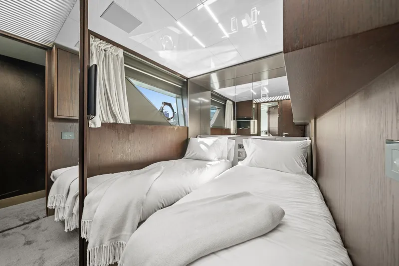 Slide: The Image of Luxurious twin bedroom in 2018 Ferretti Yachts 850, featuring modern design and elegant wood finishes. - 55