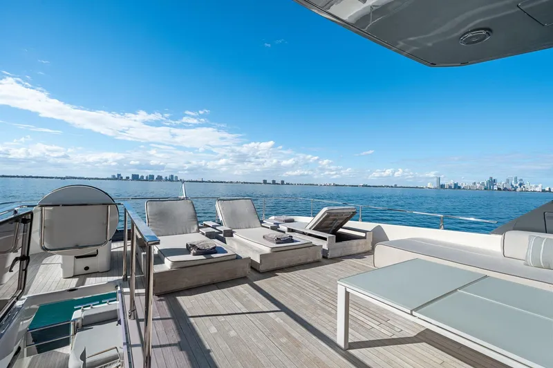 Slide: The Image of Luxurious 2018 Ferretti Yachts 850 deck with sun loungers and ocean view. - 82