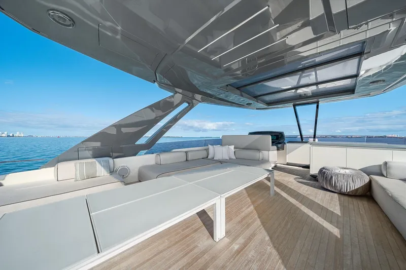 Slide: The Image of Luxurious 2018 Ferretti Yachts 850 deck with modern seating and ocean view. - 83