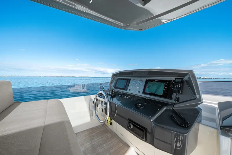 Slide: The Image of Helm of 2018 Ferretti Yachts 850 with navigation equipment, overlooking serene ocean view. - 87