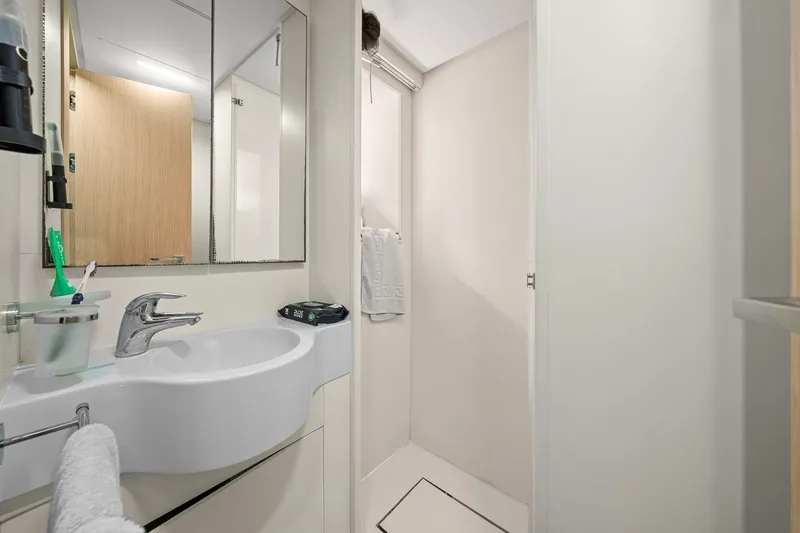 Slide: The Image of Modern bathroom in 2018 Ferretti Yachts 850, featuring sleek sink and shower area. - 93