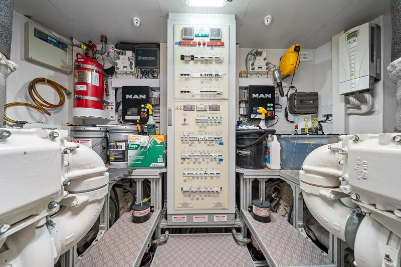 Slide: The Image of Engine room of 2018 Ferretti Yachts 850, featuring control panels and equipment. - 97