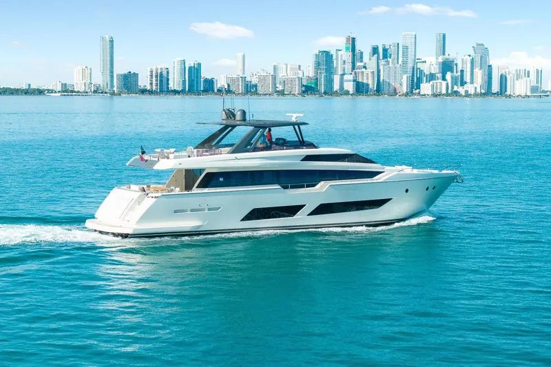 Slide: The Image of Luxurious 2018 Ferretti Yachts 850 cruising near a city skyline on a sunny day. - 15