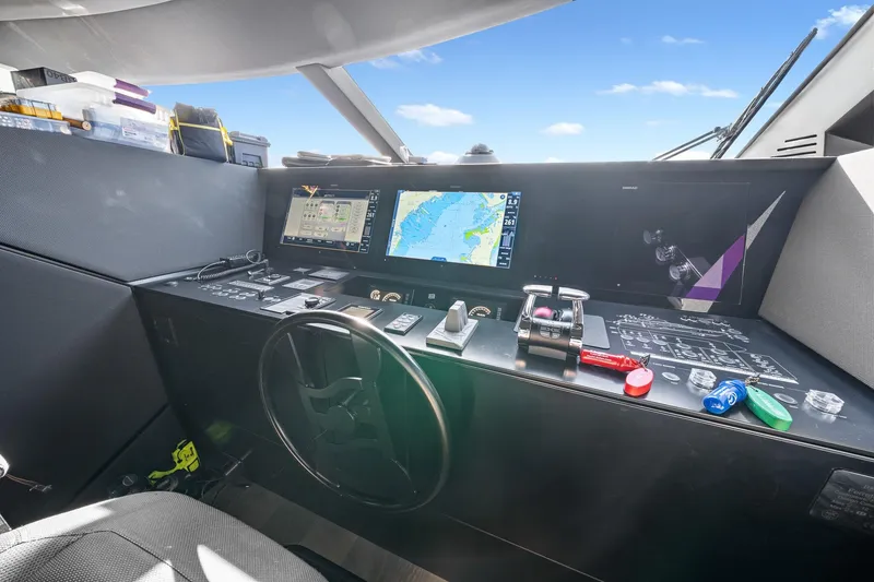Slide: The Image of Cockpit of 2018 Ferretti Yachts 850 with navigation screens and controls. - 38