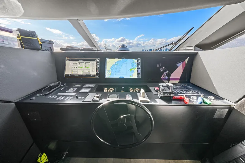 Slide: The Image of Cockpit of 2018 Ferretti Yachts 850 with navigation screens and steering wheel. - 41
