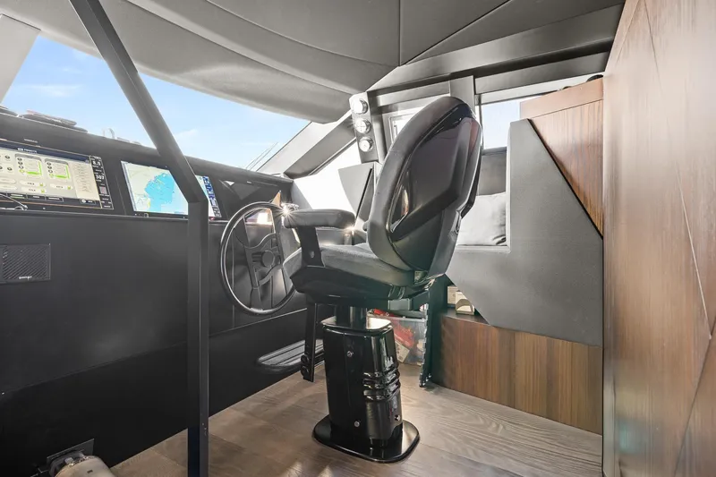 Slide: The Image of Cockpit of 2018 Ferretti Yachts 850 with modern navigation equipment and captain's chair. - 42