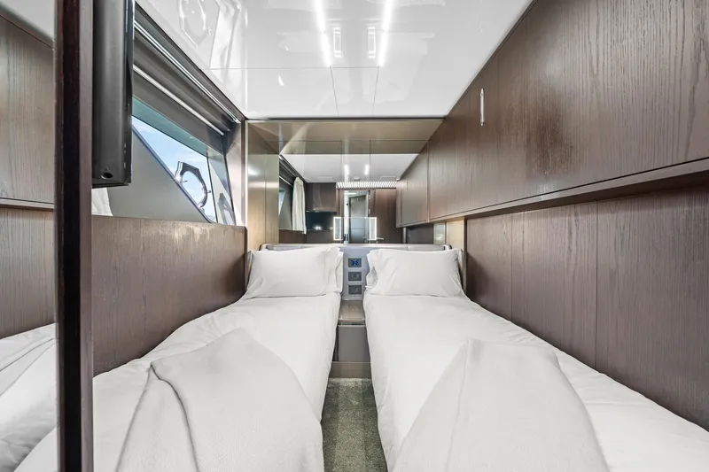 Slide: The Image of Luxurious twin cabin interior of 2018 Ferretti Yachts 850 with modern wood paneling. - 56