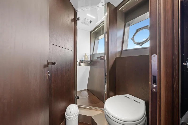Slide: The Image of Luxurious bathroom on 2018 Ferretti Yachts 850, featuring modern fixtures and elegant wood finishes. - 57
