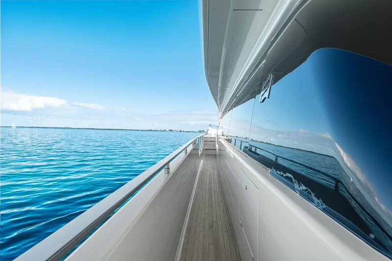 Slide: The Image of 2018 Ferretti Yachts 850 side deck with ocean view and clear blue sky. - 75