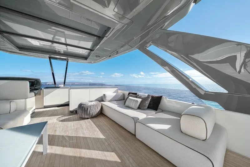 Slide: The Image of Luxurious 2018 Ferretti Yachts 850 deck with modern seating and ocean view. - 85
