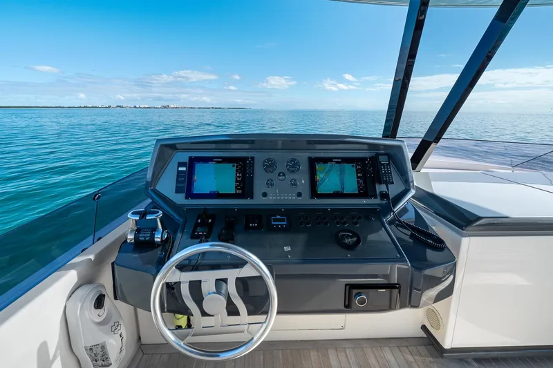 Slide: The Image of Helm of 2018 Ferretti Yachts 850 with navigation controls and ocean view. - 88