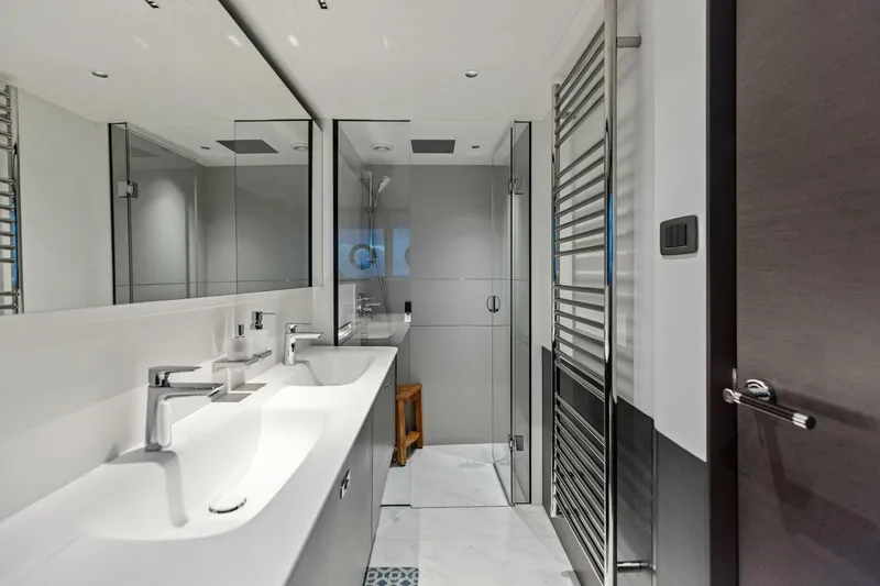 Slide: The Image of Modern bathroom in 2024 Princess X80 yacht with sleek fixtures and glass shower. - 10
