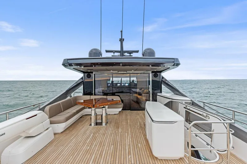 Slide: The Image of Luxurious 2024 Princess X80 yacht deck with elegant seating and ocean view. - 100