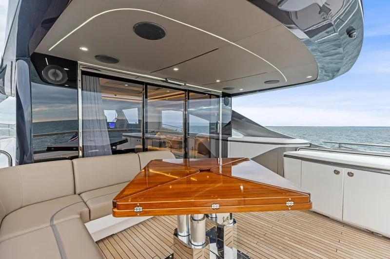 Slide: The Image of Luxurious 2024 Princess X80 yacht deck with elegant seating and ocean view. - 102