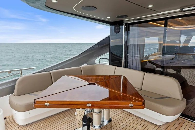 Slide: The Image of Luxurious 2024 Princess X80 yacht deck with elegant seating and ocean view. - 103