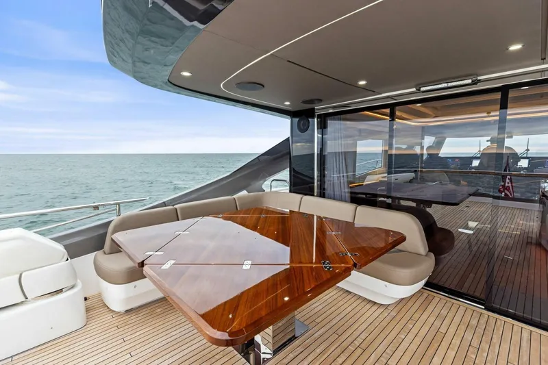 Slide: The Image of Luxurious 2024 Princess X80 yacht deck with elegant seating and ocean view. - 105